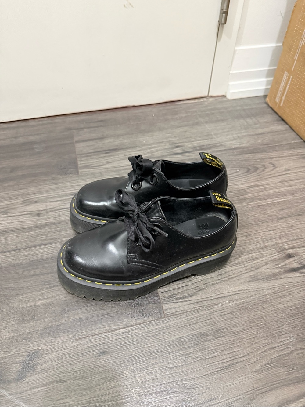 Dr. Martens HOLLY Black Leather Lace-Up Shoes with Yellow Pull-Tab and Stitching